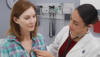 Doctor examining a patient during a kidney checkup.